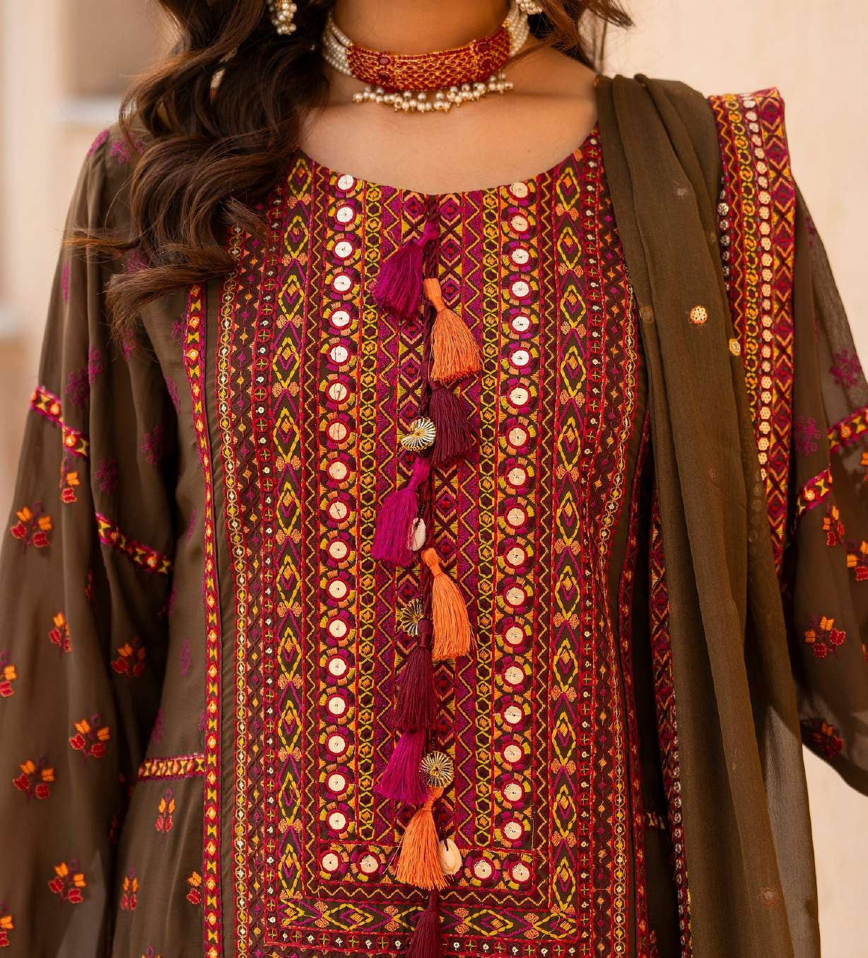 Luxury Olive Green Embroidered Designer Suit with Handcrafted Mirror Work & Tassel Accents